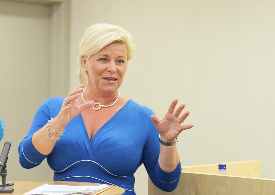 Siv Jensen kan ende opp med å få flertall for statlig skatteinnkreving, men dette kan igjen svekke arbeidet med kommunereformen. Foto: Henning Aarset Siv Jensen kan ende opp med å få flertall for statlig skatteinnkreving, men dette kan igjen svekke arbeidet med kommunereformen. Foto: Henning Aarset